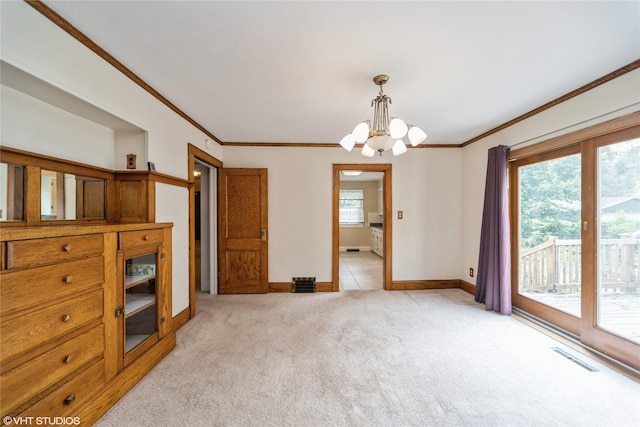 737 38th St, Des Moines, IA 50312 - unfurnished dining area featuring light carpet, a chandelier, and ornamental molding