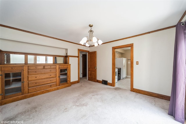 737 38th St, Des Moines, IA 50312 - unfurnished room with a chandelier, light carpet, and ornamental molding