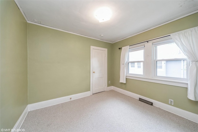 737 38th St, Des Moines, IA 50312 - carpeted empty room with crown molding and baseboards