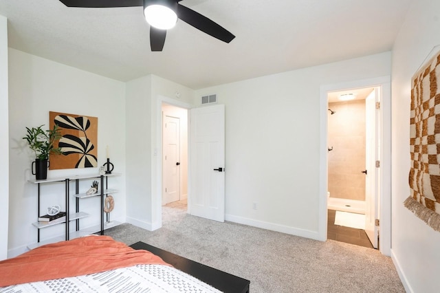 8501 NW Beaver Dr, Johnston, IA 50131 - bedroom with carpet flooring, connected bathroom, and a ceiling fan