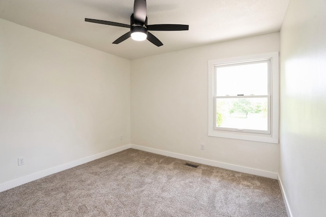 8501 NW Beaver Dr, Johnston, IA 50131 - carpeted spare room featuring baseboards and ceiling fan