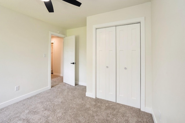 8501 NW Beaver Dr, Johnston, IA 50131 - unfurnished bedroom with carpet, a closet, and ceiling fan