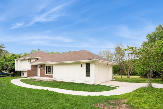 8501 NW Beaver Dr, Johnston, IA 50131 - back of house featuring an attached garage, a yard, and driveway