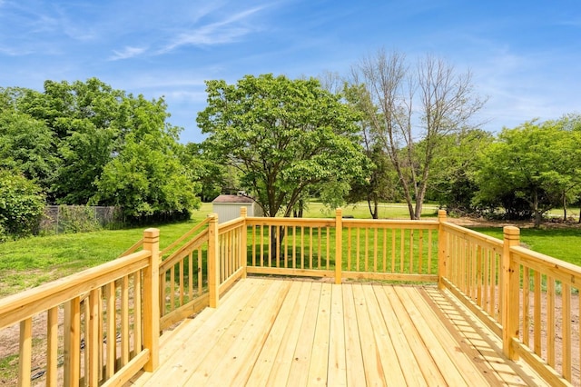 8501 NW Beaver Dr, Johnston, IA 50131 - deck with a storage unit, a yard, and view of scattered trees