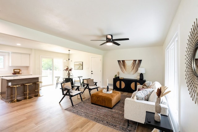 8501 NW Beaver Dr, Johnston, IA 50131 - living room with light wood-style flooring and ceiling fan