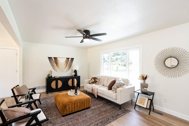 8501 NW Beaver Dr, Johnston, IA 50131 - living room with a ceiling fan and wood finished floors