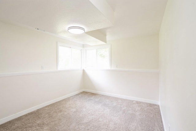 8501 NW Beaver Dr, Johnston, IA 50131 - carpeted spare room with baseboards