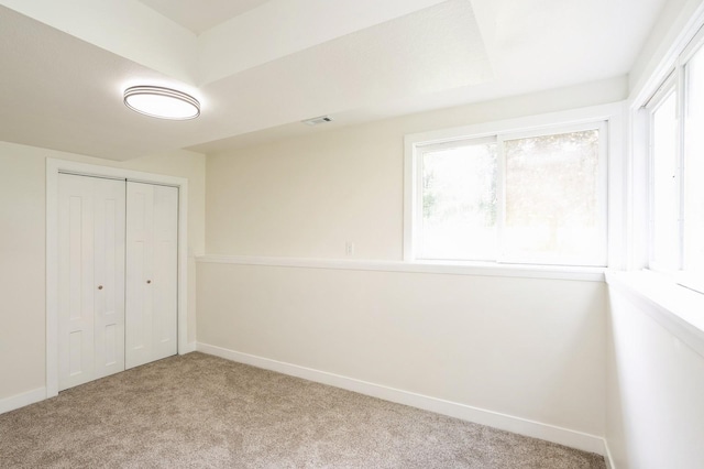 8501 NW Beaver Dr, Johnston, IA 50131 - unfurnished bedroom with light carpet and a closet