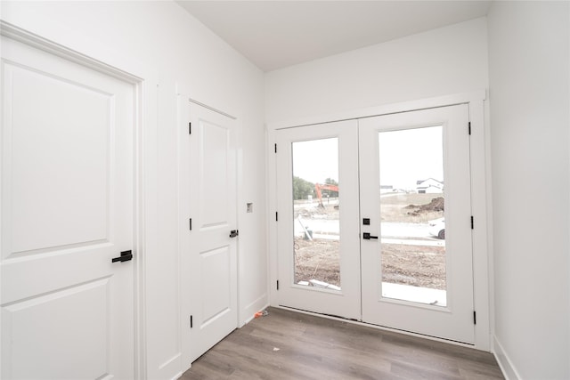 17987 Alpine Dr, Clive, IA 50325 - doorway featuring french doors and light wood finished floors