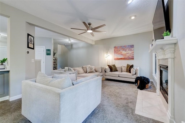 5583 Meredith Dr Unit 5C, Des Moines, IA 50310 - carpeted living room featuring a ceiling fan, a fireplace with flush hearth, and recessed lighting