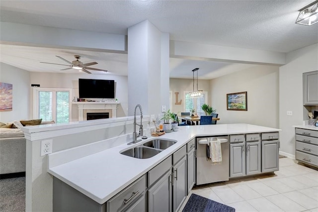 5583 Meredith Dr Unit 5C, Des Moines, IA 50310 - kitchen featuring dishwasher, gray cabinetry, open floor plan, a peninsula, and a textured ceiling