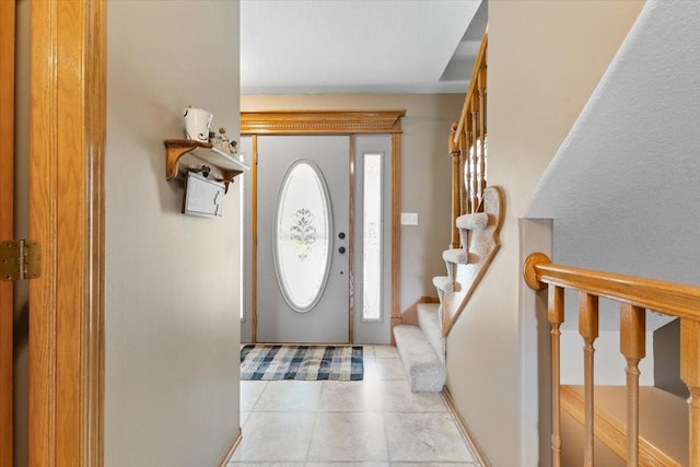 1305 NW Wagner Blvd, Ankeny, IA 50023 - foyer entrance with stairway and light tile patterned floors