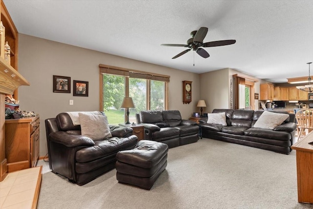 1305 NW Wagner Blvd, Ankeny, IA 50023 - living area with light colored carpet, a ceiling fan, and a textured ceiling