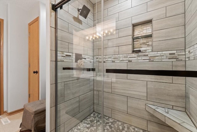 1305 NW Wagner Blvd, Ankeny, IA 50023 - bathroom featuring a stall shower and tile patterned flooring
