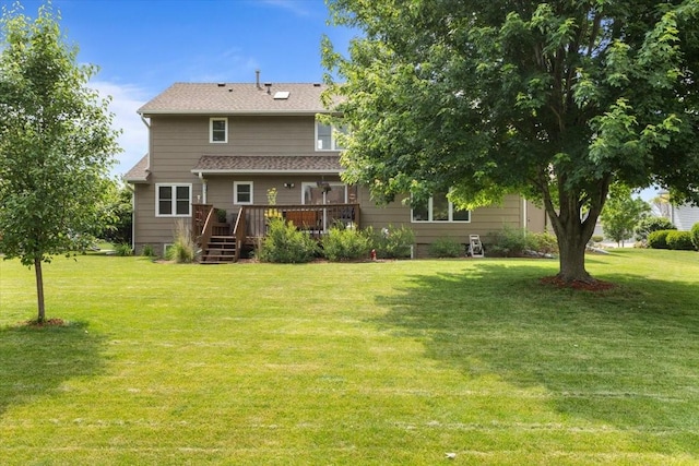 1305 NW Wagner Blvd, Ankeny, IA 50023 - back of house featuring a wooden deck and a yard