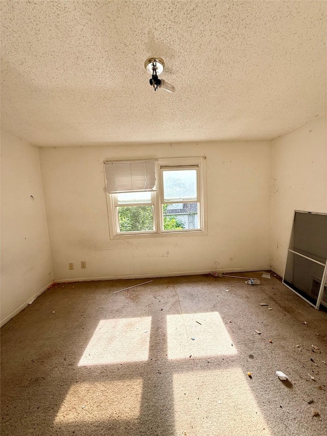 2216 Logan Ave, Des Moines, IA 50317 - empty room featuring a textured ceiling