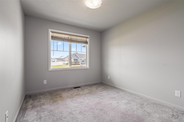 7825 SE 2nd St, Des Moines, IA 50320 - spare room featuring carpet flooring and baseboards
