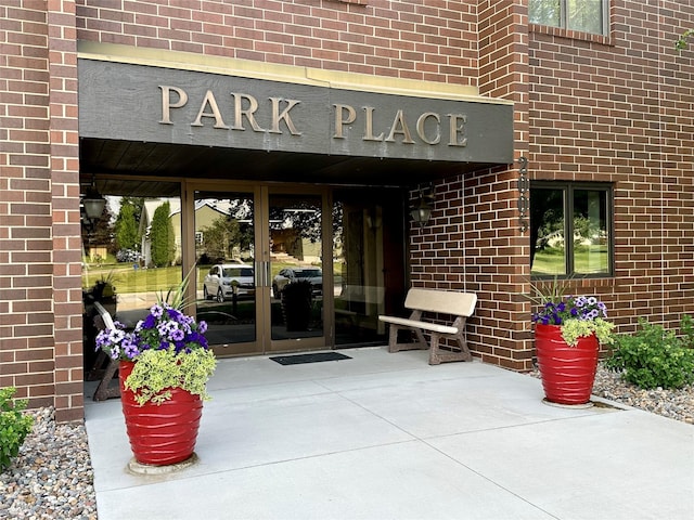 2005 Spring St Unit U203, Grinnell, IA 50112 - property entrance featuring french doors and brick siding