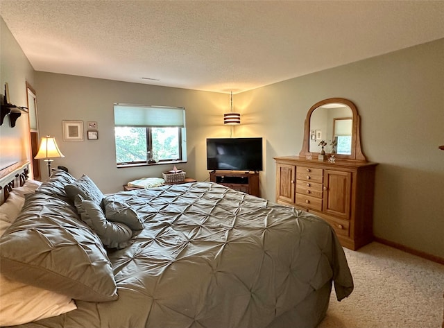 2005 Spring St Unit U203, Grinnell, IA 50112 - bedroom featuring light colored carpet and a textured ceiling
