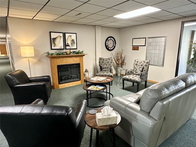 2005 Spring St Unit U203, Grinnell, IA 50112 - carpeted living area featuring mail area, a glass covered fireplace, and a paneled ceiling