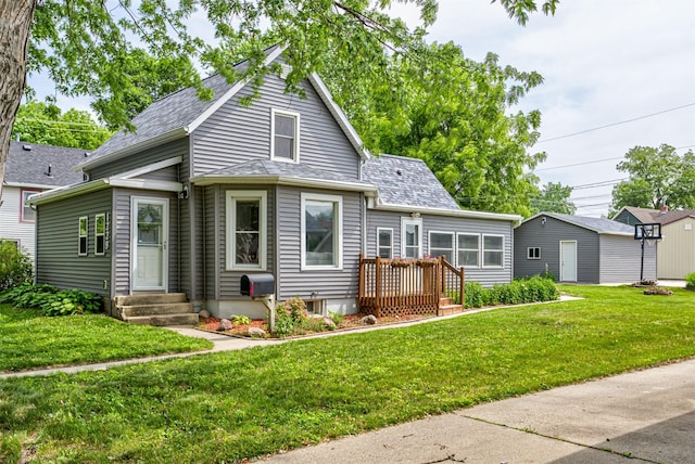 1229 9th St, Nevada, IA 50201 - view of front facade featuring entry steps, a front lawn, and roof with shingles