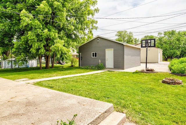 1229 9th St, Nevada, IA 50201 - view of outbuilding featuring an outdoor fire pit