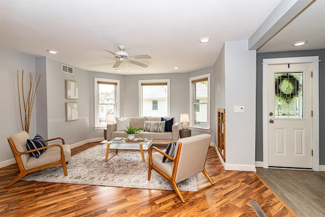 1229 9th St, Nevada, IA 50201 - living area featuring light wood-type flooring, a ceiling fan, and recessed lighting