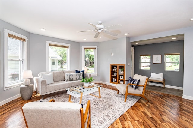 1229 9th St, Nevada, IA 50201 - living room featuring wood finished floors, a ceiling fan, and recessed lighting