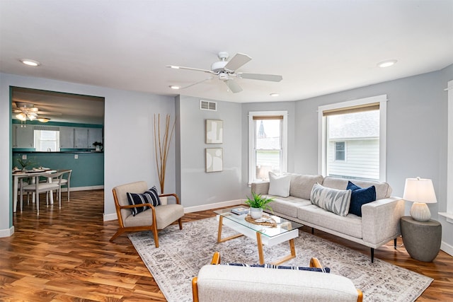 1229 9th St, Nevada, IA 50201 - living room featuring a ceiling fan, wood finished floors, and recessed lighting