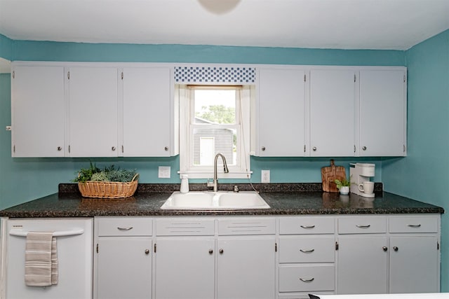 1229 9th St, Nevada, IA 50201 - kitchen featuring white cabinetry and dark countertops