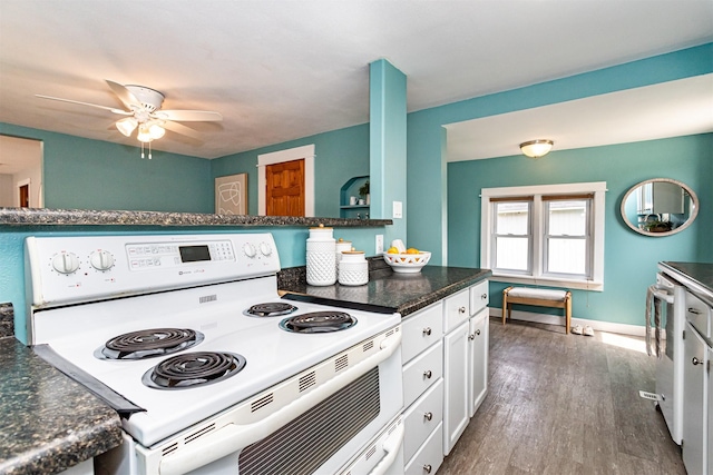 1229 9th St, Nevada, IA 50201 - kitchen with white electric stove, a ceiling fan, white cabinets, stainless steel dishwasher, and dark wood finished floors