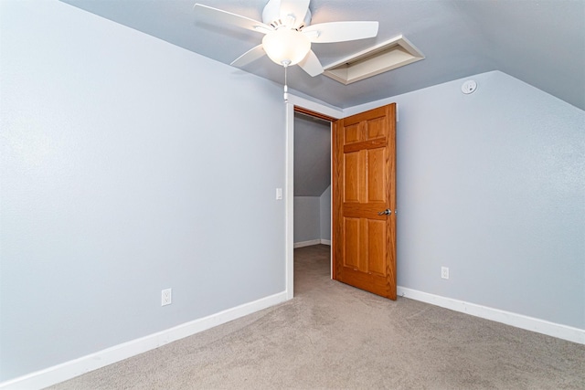 1229 9th St, Nevada, IA 50201 - carpeted spare room with a smoke detector, ceiling fan, and lofted ceiling