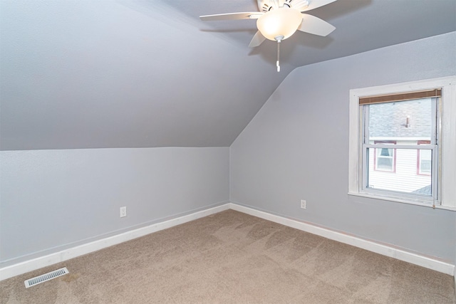 1229 9th St, Nevada, IA 50201 - bonus room featuring carpet flooring, vaulted ceiling, and ceiling fan