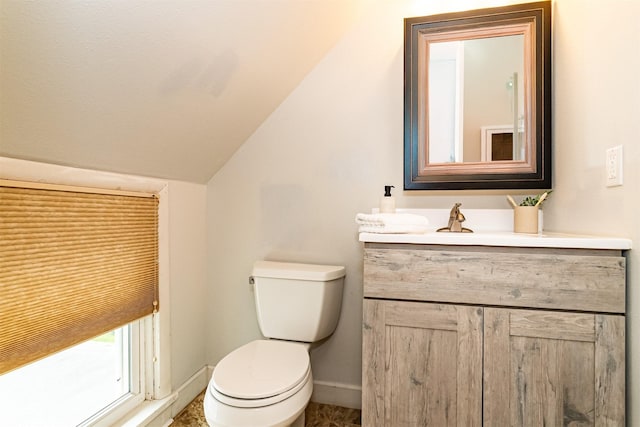 1229 9th St, Nevada, IA 50201 - half bath featuring vanity and lofted ceiling