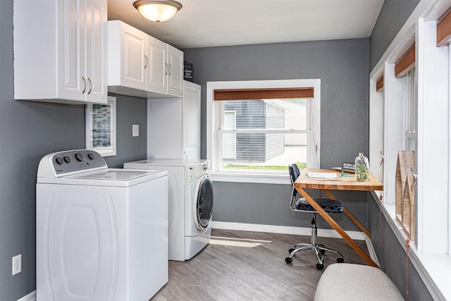 1229 9th St, Nevada, IA 50201 - laundry area with washing machine and dryer, cabinet space, light wood-style floors, and an office area