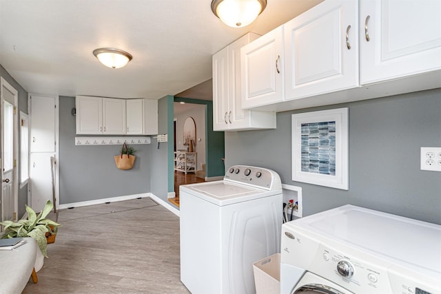 1229 9th St, Nevada, IA 50201 - laundry area featuring independent washer and dryer and light wood finished floors