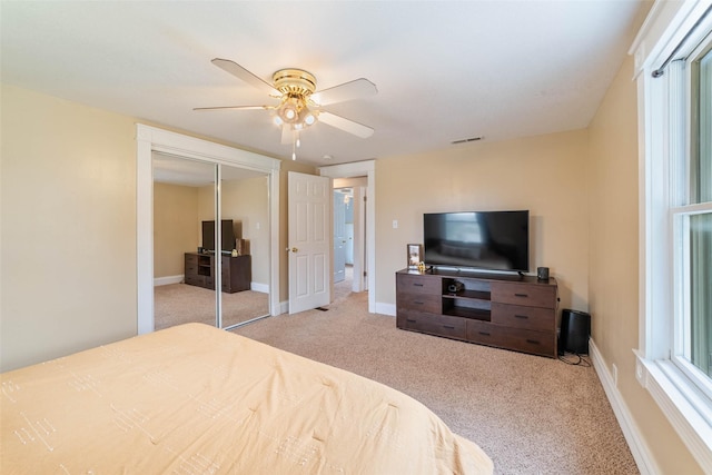 2800 E Douglas Ave, Des Moines, IA 50317 - carpeted bedroom with a closet and ceiling fan