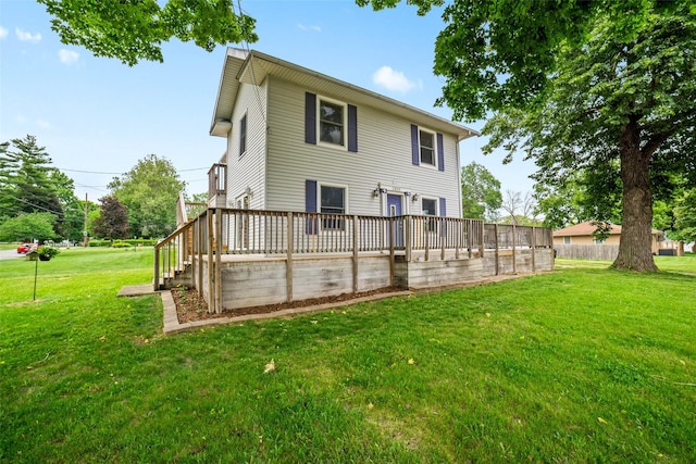 2800 E Douglas Ave, Des Moines, IA 50317 - back of property featuring a yard and a wooden deck