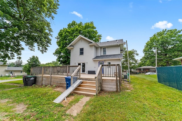 2800 E Douglas Ave, Des Moines, IA 50317 - back of property with a wooden deck and a lawn