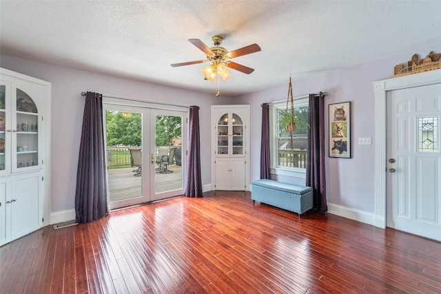 2800 E Douglas Ave, Des Moines, IA 50317 - unfurnished room with french doors, ceiling fan, wood finished floors, and a textured ceiling