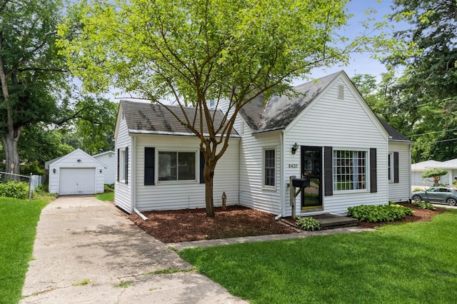 6420 Center St, Des Moines, IA 50312 - view of front of property featuring concrete driveway, an outbuilding, roof with shingles, and a detached garage