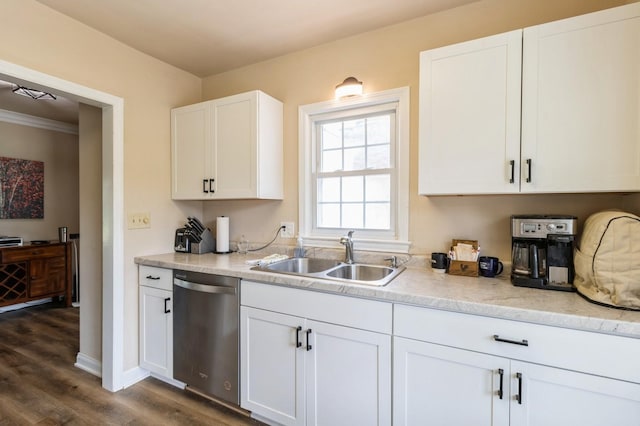 6420 Center St, Des Moines, IA 50312 - kitchen with dishwasher, dark wood finished floors, white cabinets, and crown molding