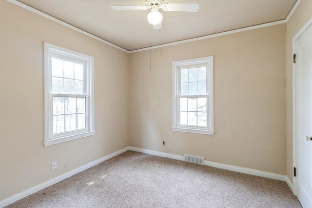 6420 Center St, Des Moines, IA 50312 - unfurnished room featuring carpet flooring, ornamental molding, and ceiling fan