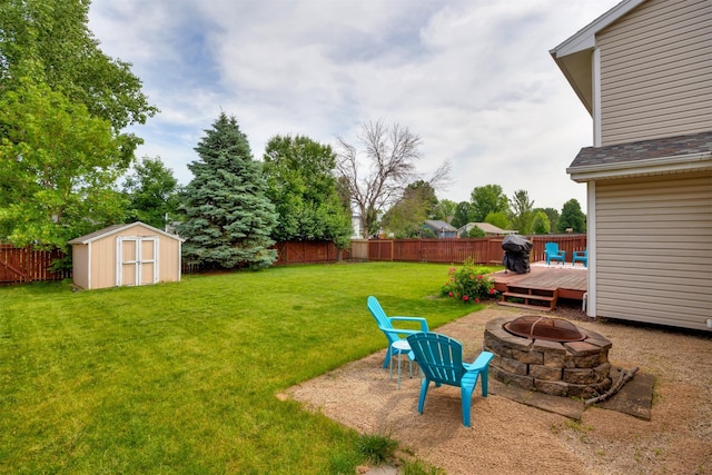 905 SE Meadowlark Dr, Grimes, IA 50111 - fenced backyard featuring an outdoor fire pit, a storage shed, and a deck