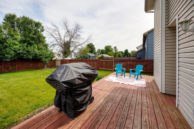 905 SE Meadowlark Dr, Grimes, IA 50111 - wooden deck featuring a fenced backyard and a grill