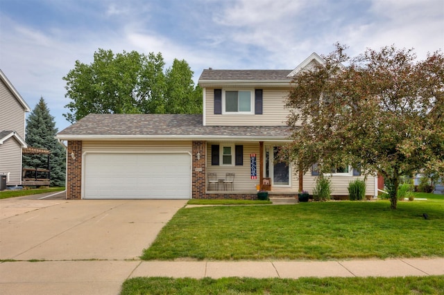 905 SE Meadowlark Dr, Grimes, IA 50111 - view of front of property with a garage, covered porch, a front yard, and concrete driveway