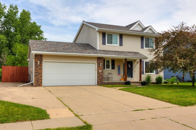 905 SE Meadowlark Dr, Grimes, IA 50111 - view of front of home with covered porch, an attached garage, driveway, and brick siding
