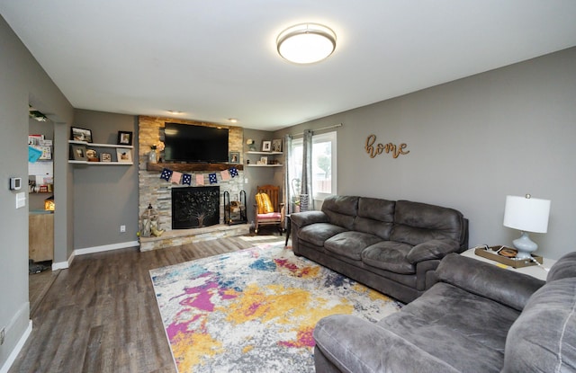 905 SE Meadowlark Dr, Grimes, IA 50111 - living area with wood finished floors and a stone fireplace