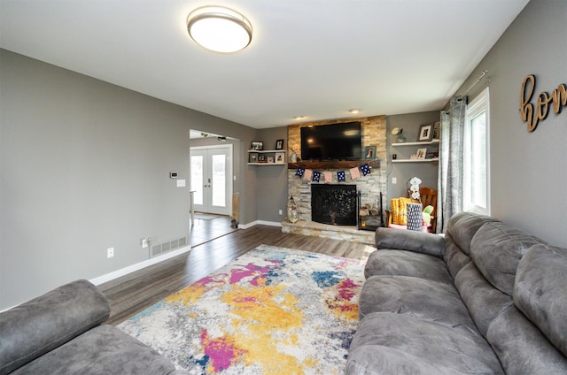 905 SE Meadowlark Dr, Grimes, IA 50111 - living room featuring wood finished floors and a fireplace