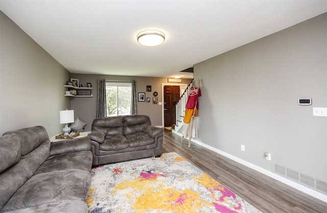 905 SE Meadowlark Dr, Grimes, IA 50111 - living area featuring wood finished floors and stairs